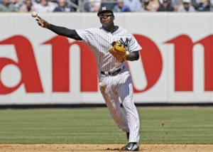 FILE - In this April 6, 2015, file photo, New York Yankees shortstop Didi Gregorius throws to first in the fourth inning of an opening day baseball game against the Toronto Blue Jays in New York. (AP Photo/Kathy Willens, File)